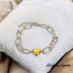 Pulsera color plata acero inoxidable corazon dorado