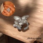 Anillo ajustable color plata acero inoxidable doble mariposa